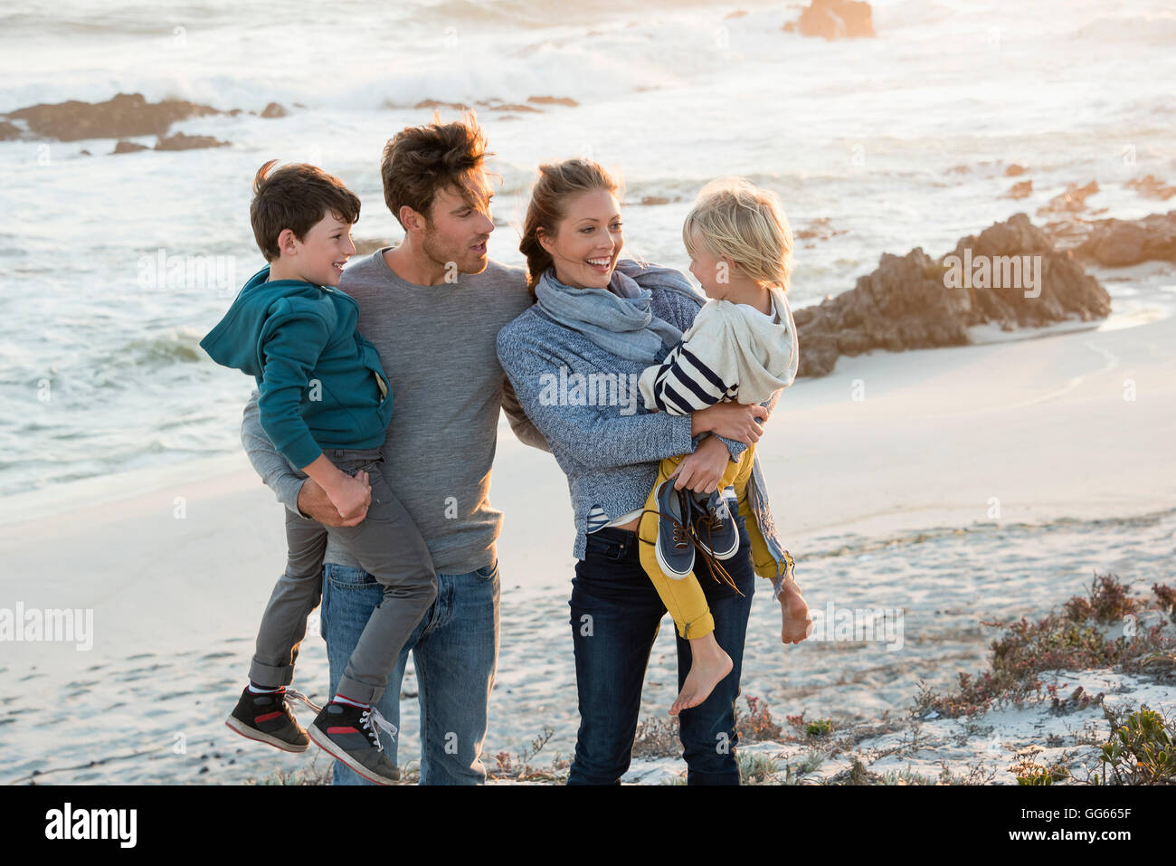 Family at dusk beach hi-res stock photography and images - Alamy