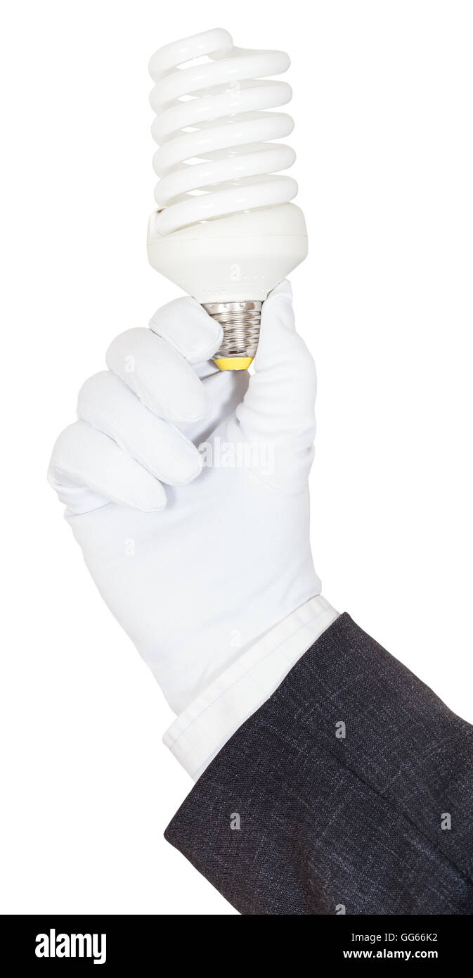 hand in business suit and textile glove holds compact fluorescent lamp ...