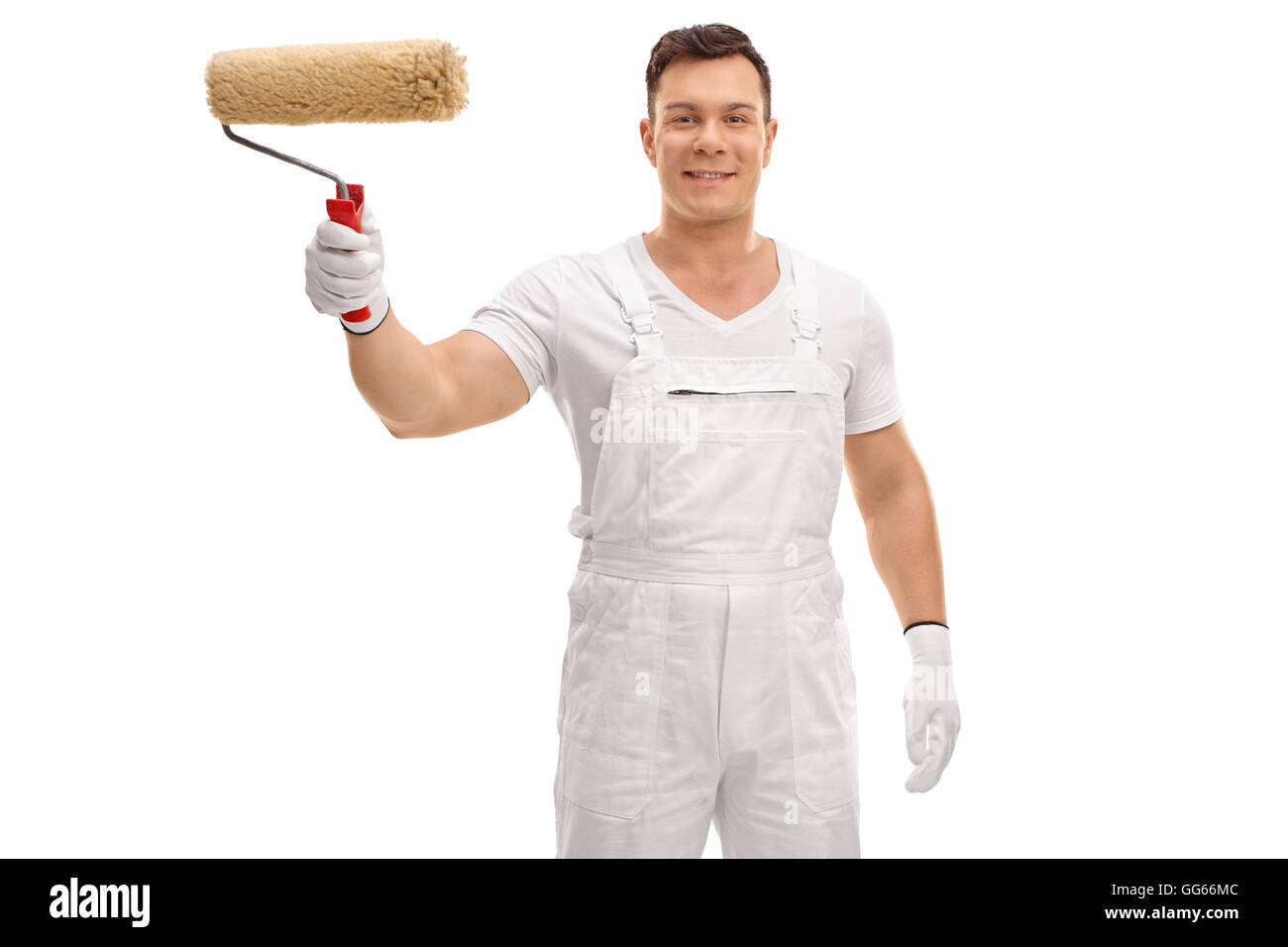 Young painter holding a paint roller in his hand isolated on white background Stock Photo