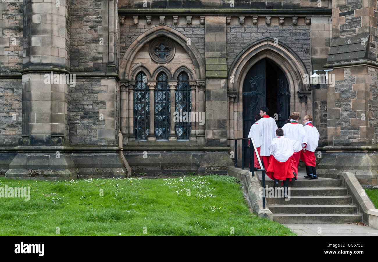 St Mary's Cathedral (Episcopal), Palmerston Place, Edinburgh. Choristers outside the church on their way to a service Stock Photo