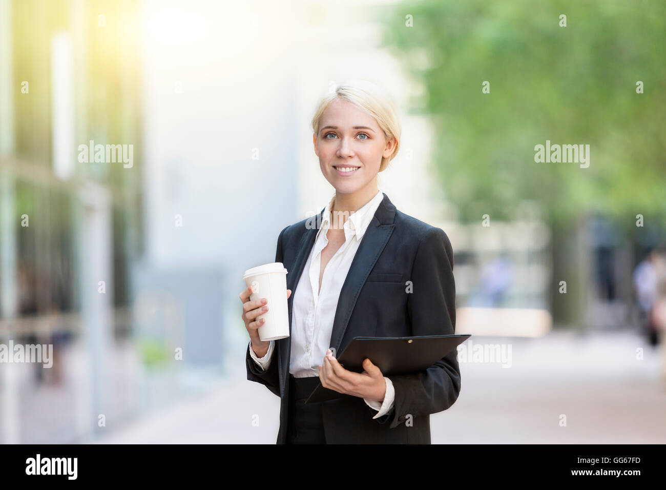 Businesswoman having a coffee break Stock Photo - Alamy