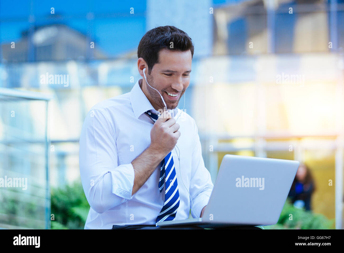 Businessman chatting outdoors in financial district Stock Photo