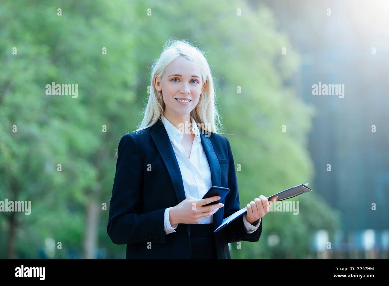 Portrait of a Businesswoman using a smartphone Stock Photo