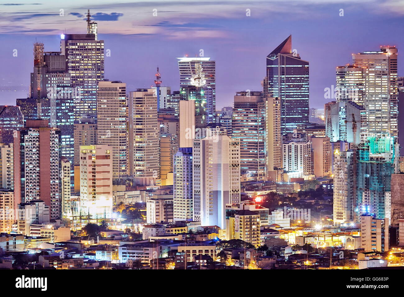 Philippines, Luzon, Manila. Makati business district with Louis Vuitton  advertising board and a rainbow over the city skyline Stock Photo - Alamy