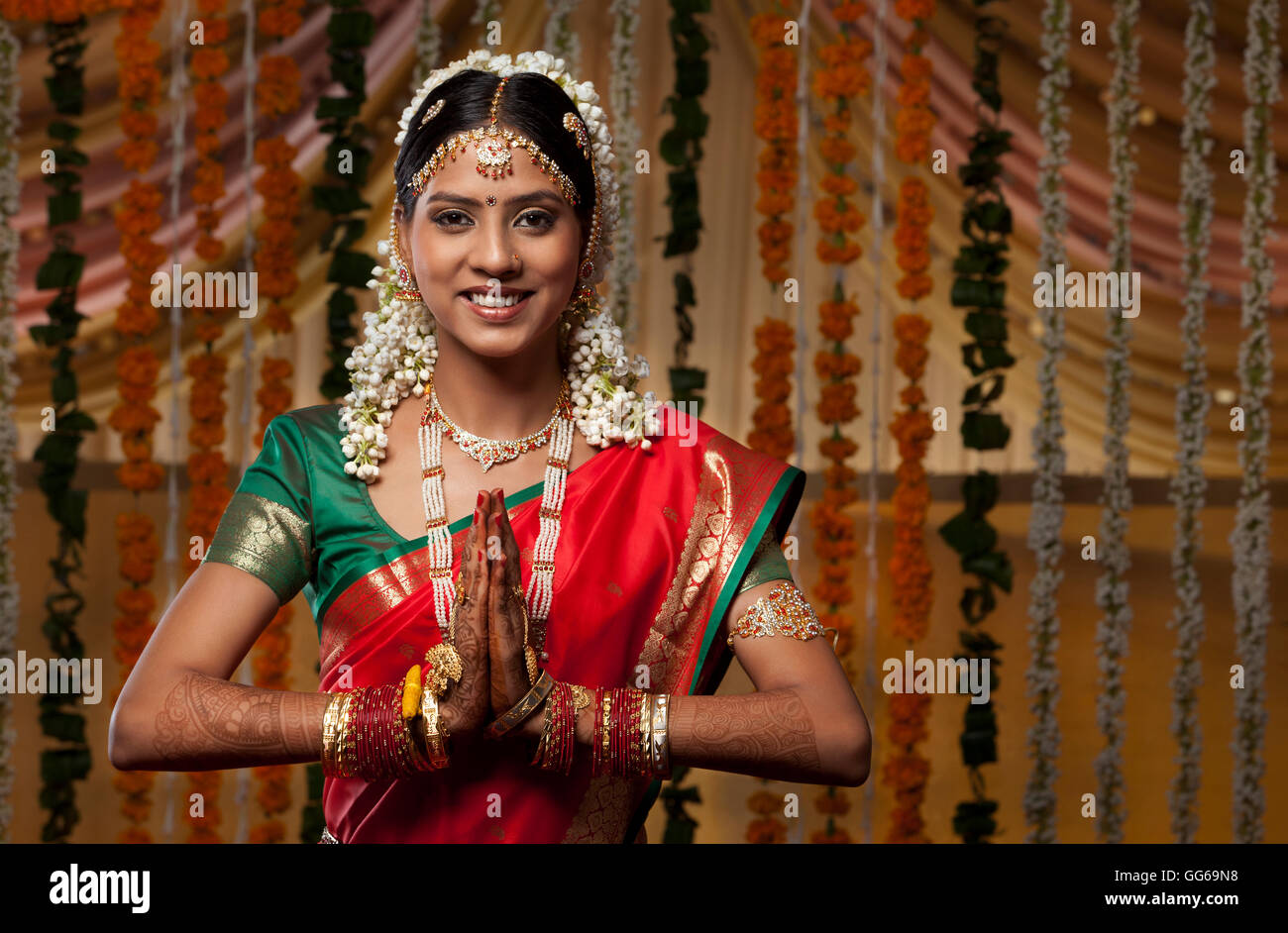 Indian woman greeting Namaste Stock Photo - Alamy