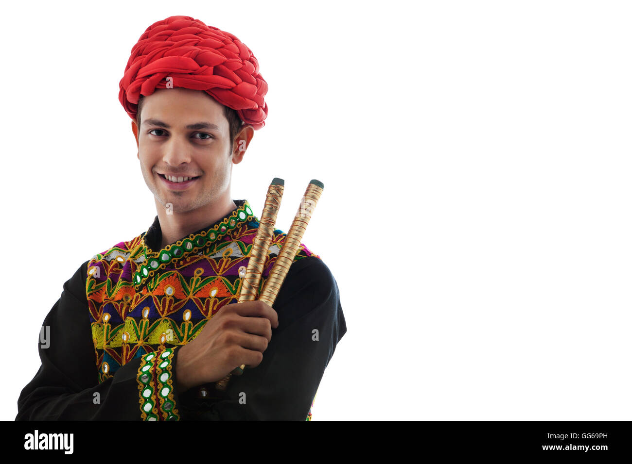 Portrait of a male dandiya dancer with sticks Stock Photo - Alamy