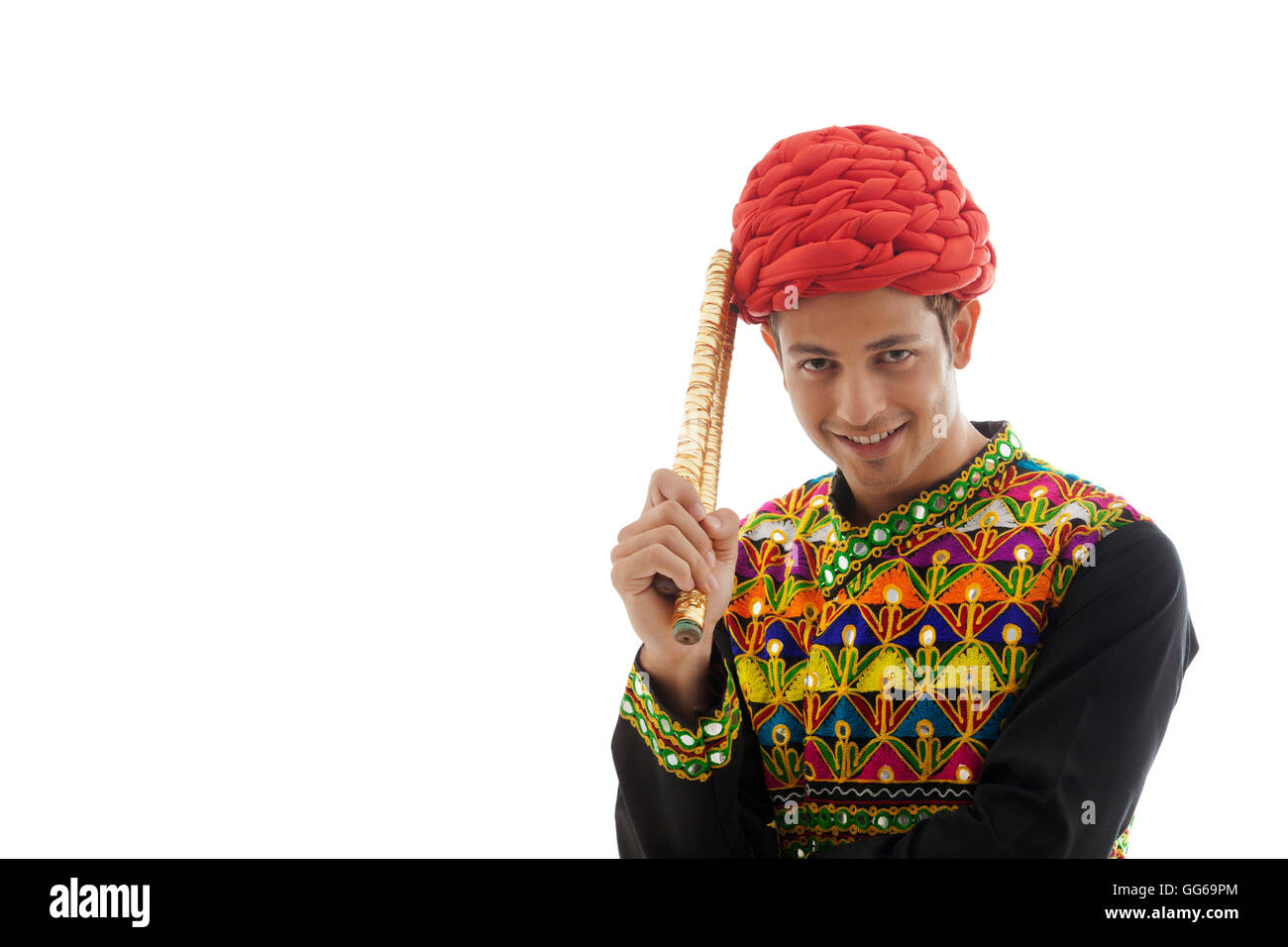 Portrait of a male dandiya dancer with sticks Stock Photo - Alamy
