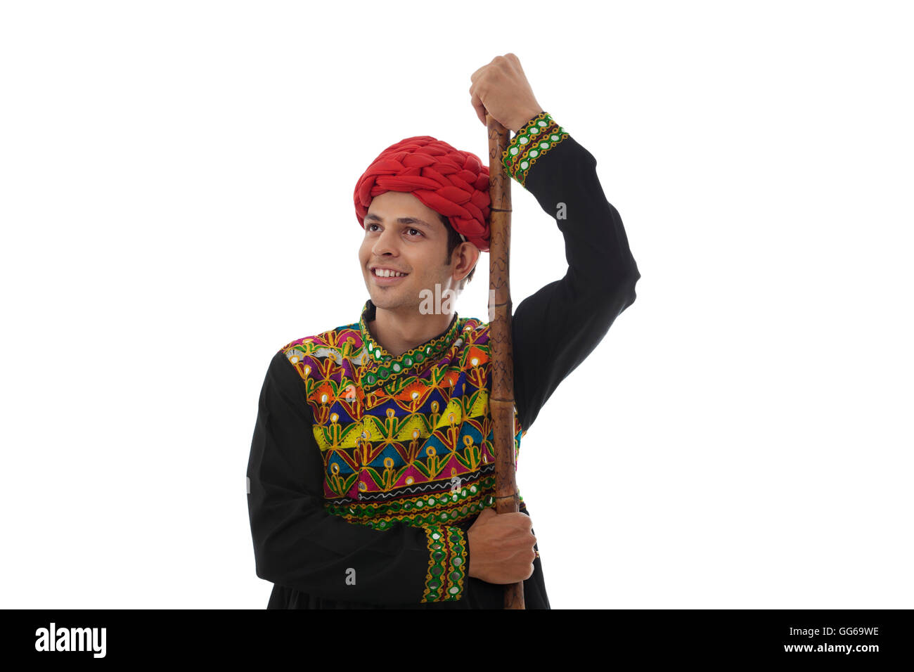 Male dandiya dancer with a stick Stock Photo - Alamy