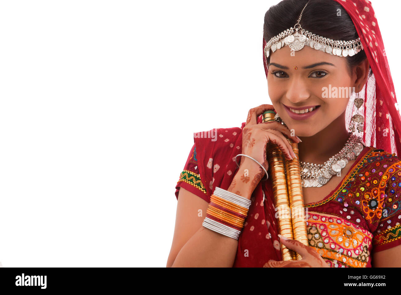 Portrait of a female dandiya dancer with sticks Stock Photo - Alamy