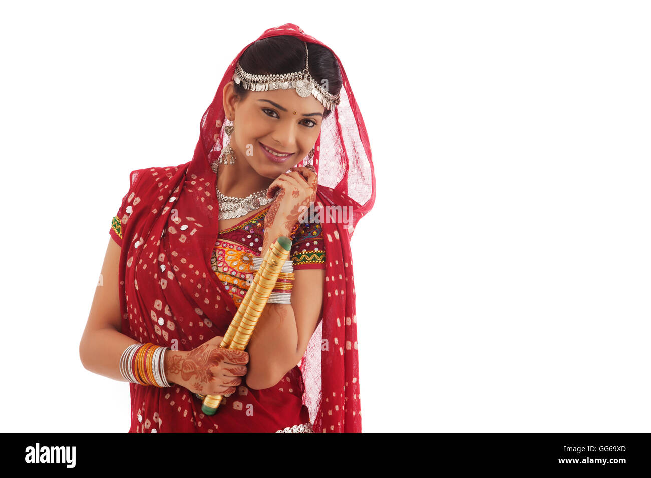 Portrait of a female dandiya dancer with sticks Stock Photo - Alamy