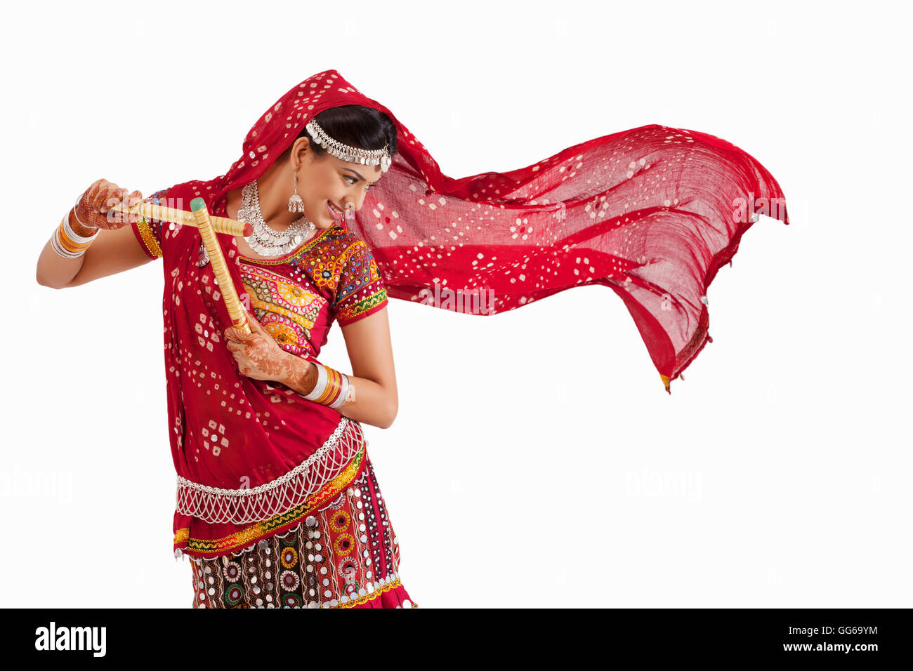 Female dandiya dancer dancing with sticks Stock Photo - Alamy