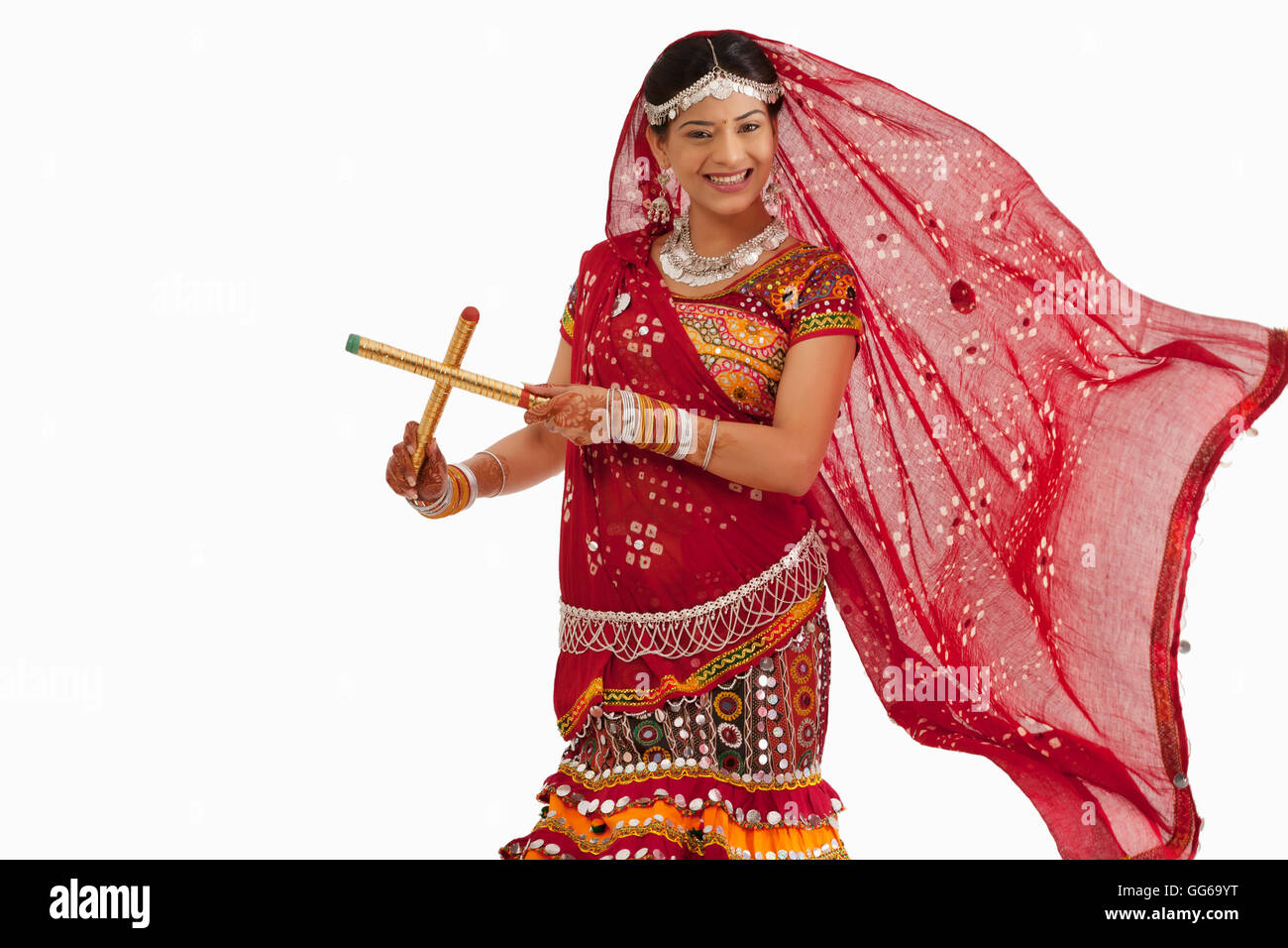 Portrait of a female dandiya dancer with sticks Stock Photo - Alamy