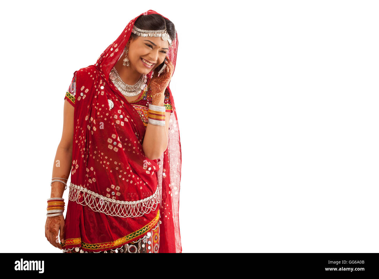 Female dandiya dancer talking on a mobile phone Stock Photo - Alamy