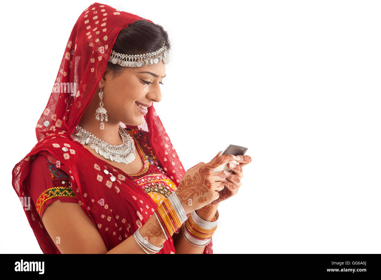 Female dandiya dancer reading an sms Stock Photo - Alamy