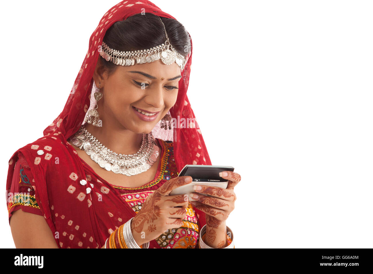 Female dandiya dancer reading an sms Stock Photo - Alamy