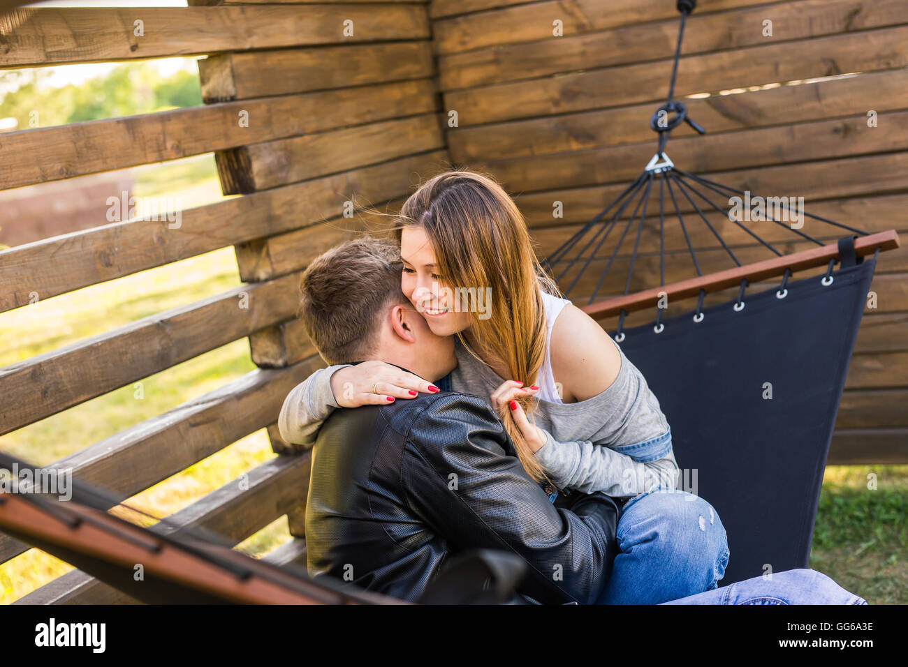 pregnant woman with her husband on hammock Stock Photo Alamy