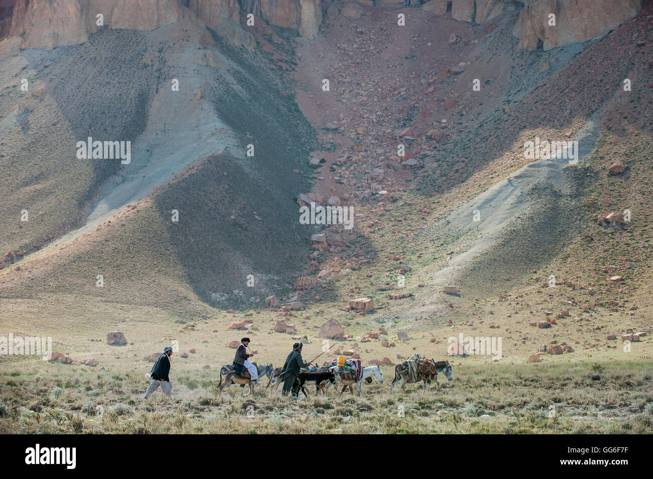 Donkeys and farmers make their way home near Band-e Amir, Afghanistan, Asia Stock Photo