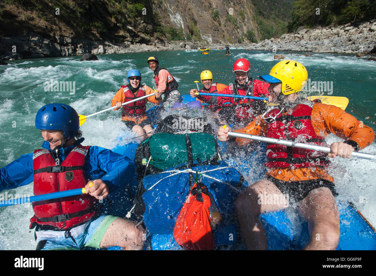 Rafters get splashed as they go through some big rapids on the Karnali River in Nepal, Asia Stock Photo