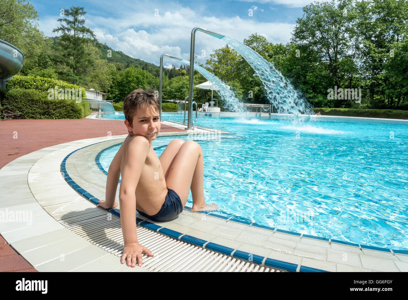 Portrait teen boy in a swimming pool Stock Photo