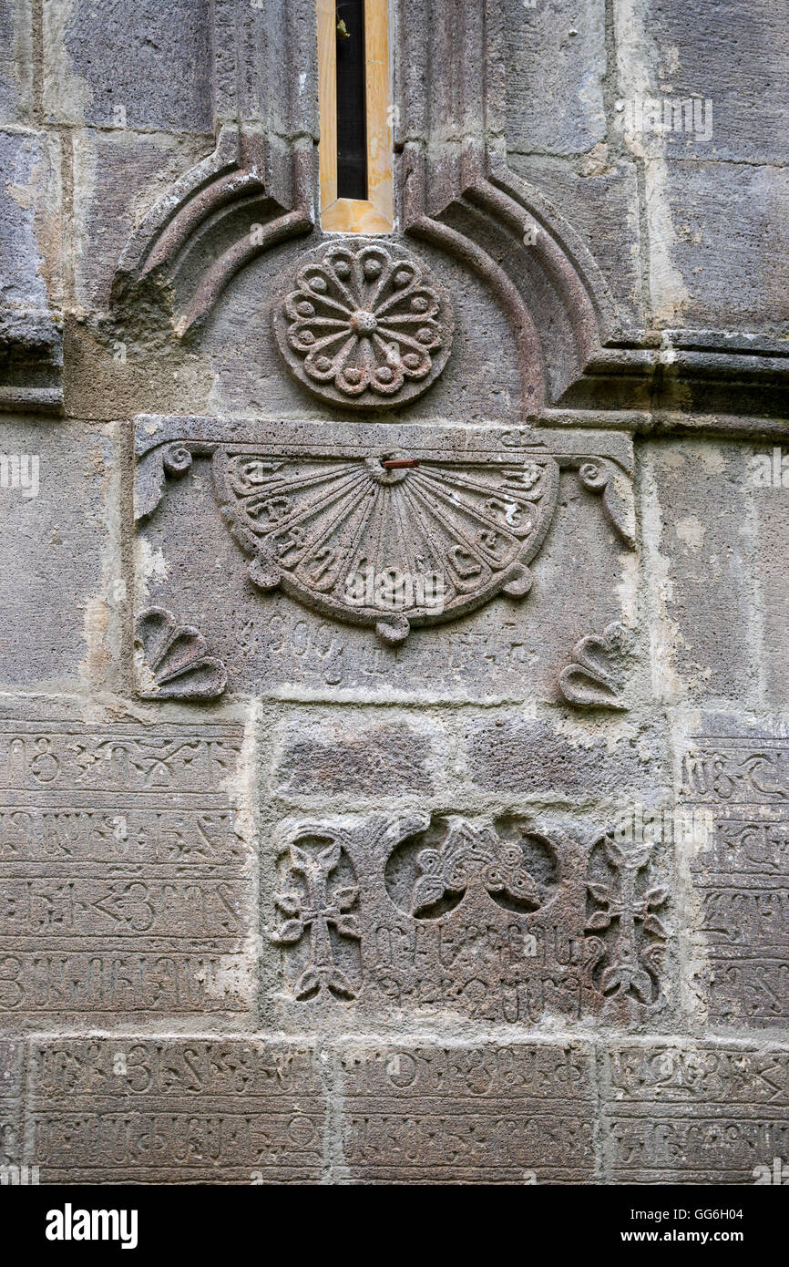 Sundial on facade of Surb Stepanos church at Hagartsin monastery in Armenia Stock Photo