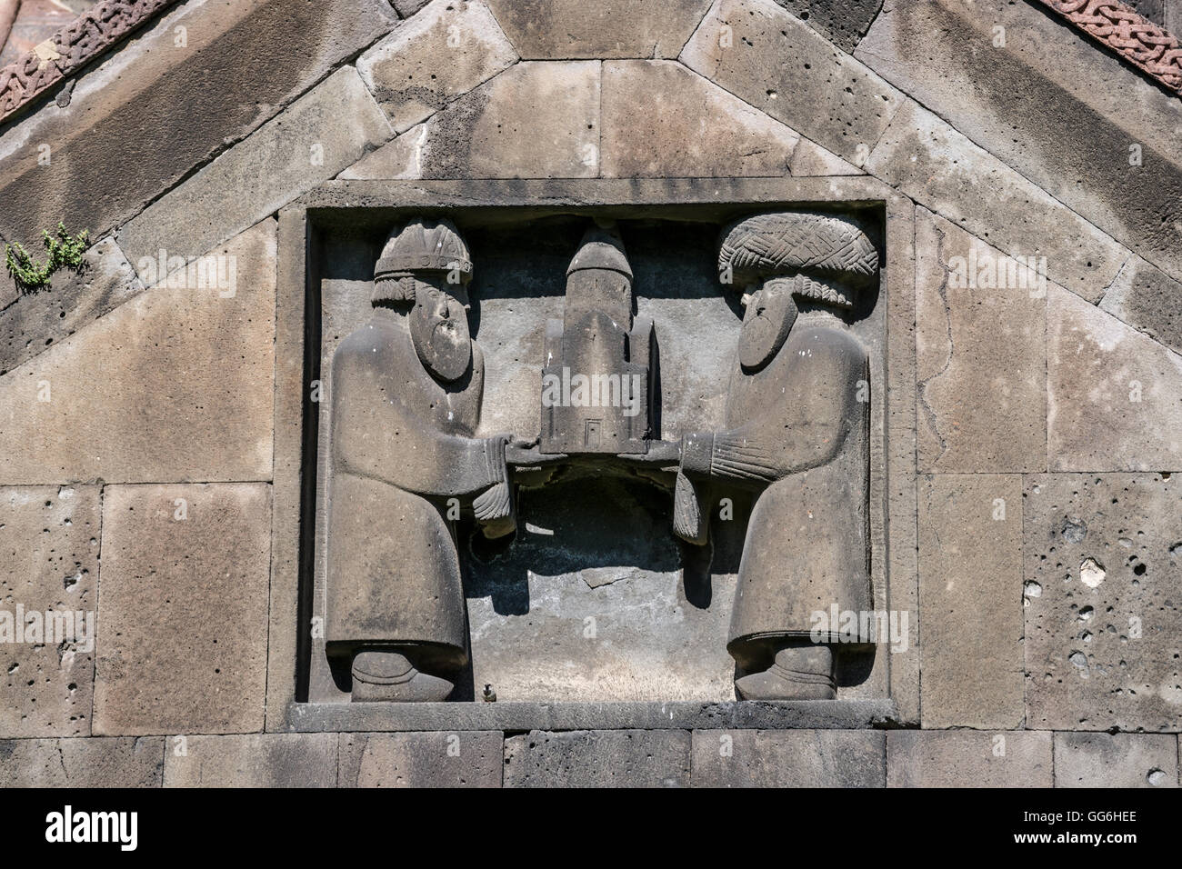 Bas-relief on eastern facade of Surp Nshan church depicting ktetors of the monastery. Haghpat monastery in Armenia Stock Photo