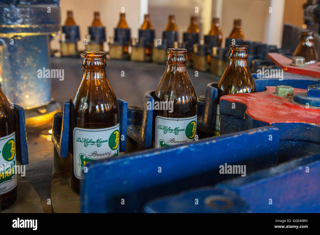 Beer bottles on the assembly line of Brouwerij Henri Maes, Belgian brewery at Bruges, Belgium Stock Photo