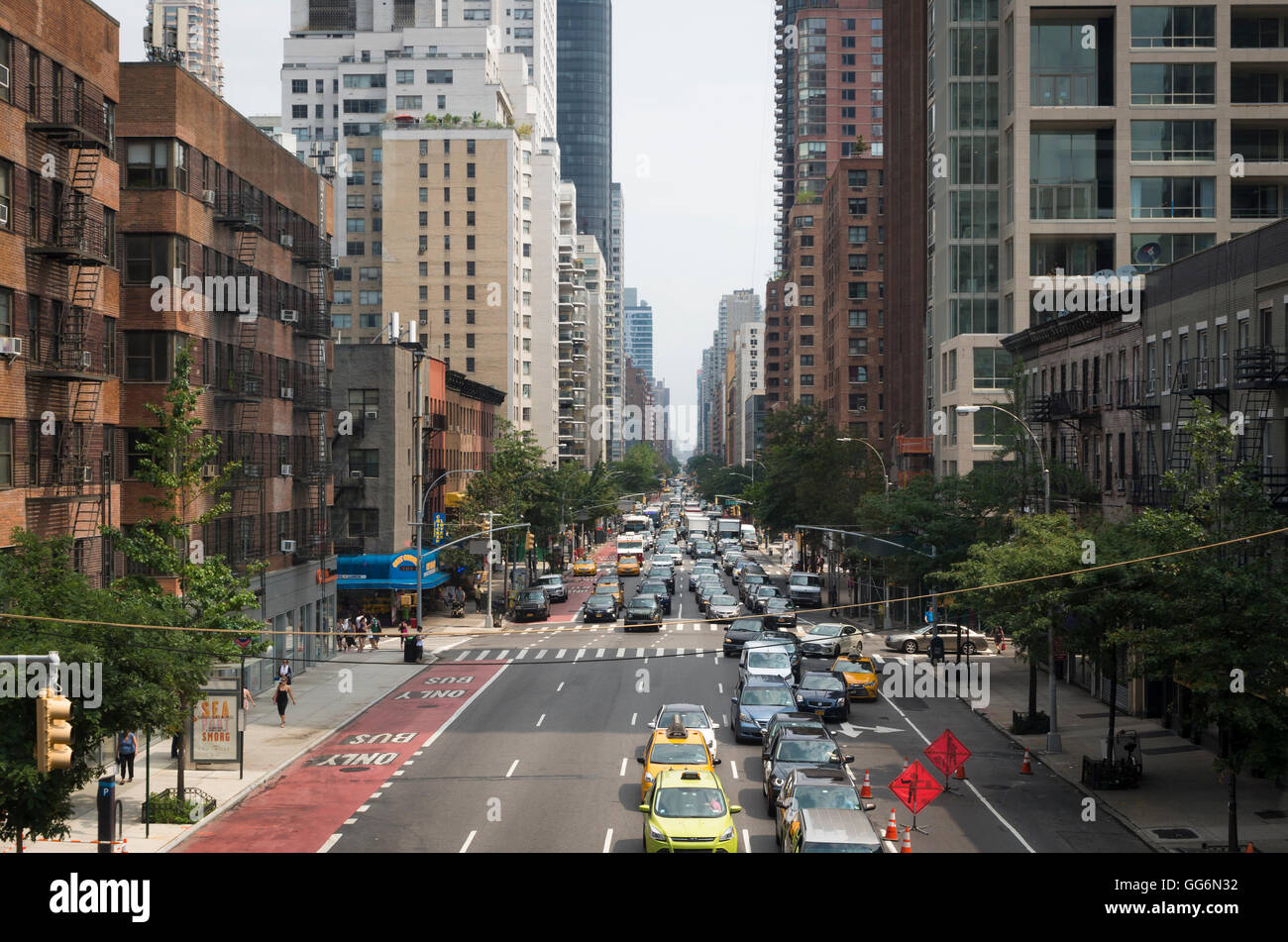 View along 2nd Avenue, New York City, with traffic and skyscraper buildings,. Stock Photo