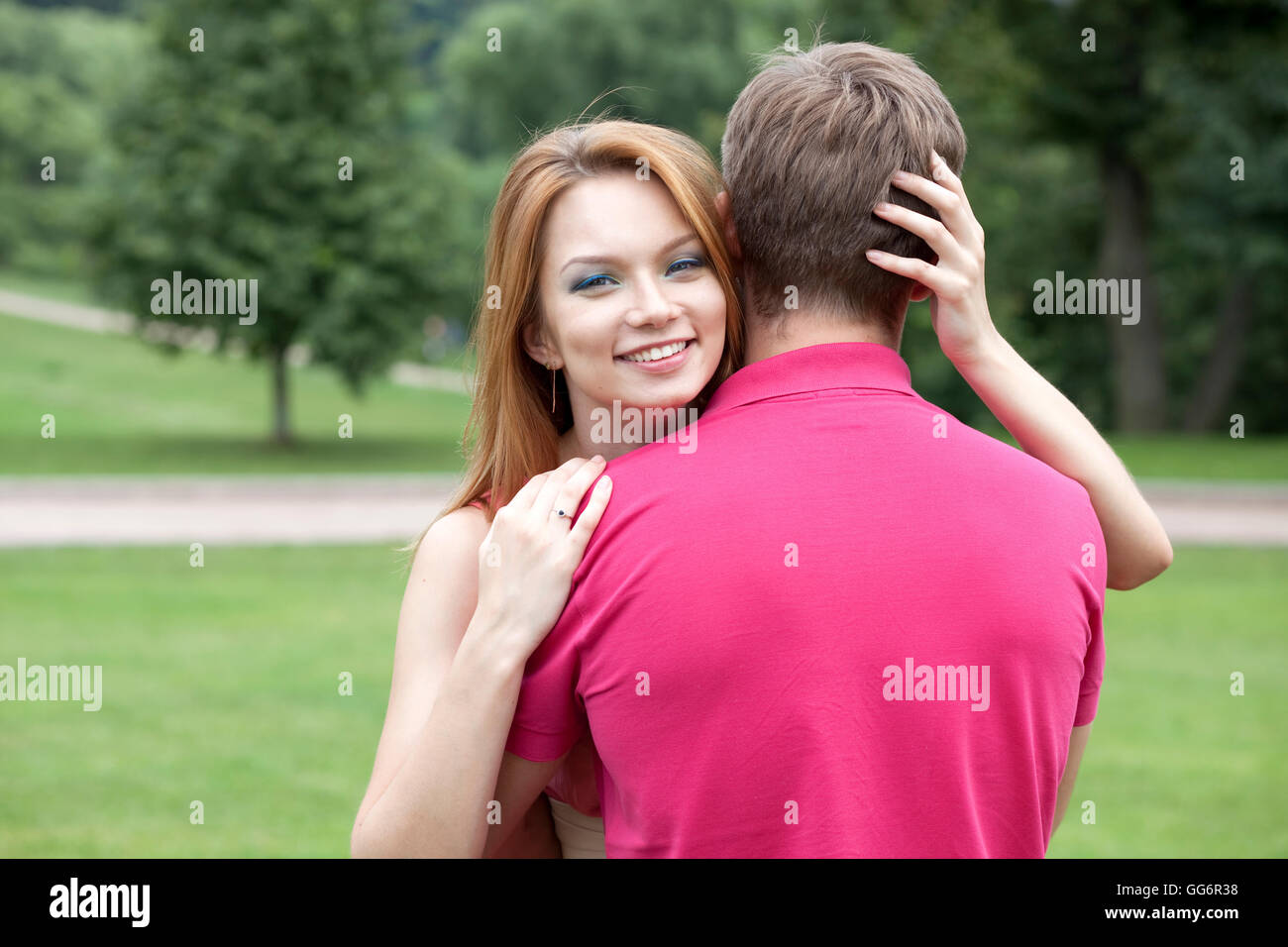 Young beautiful girl hugging her favorite guy Stock Photo - Alamy