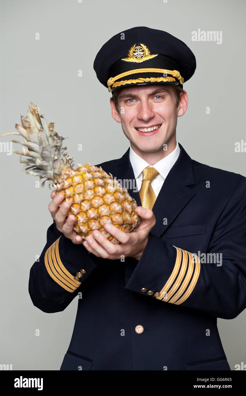 Portrait of a young man in the form of a passenger plane pilot Stock Photo