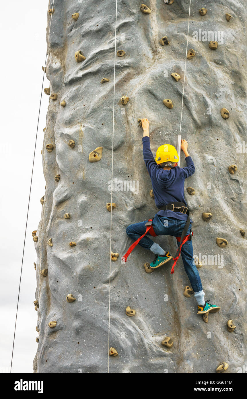 Young boy climbing a wall at the annual Seaman's Festival, Reykjavik, Iceland Stock Photo