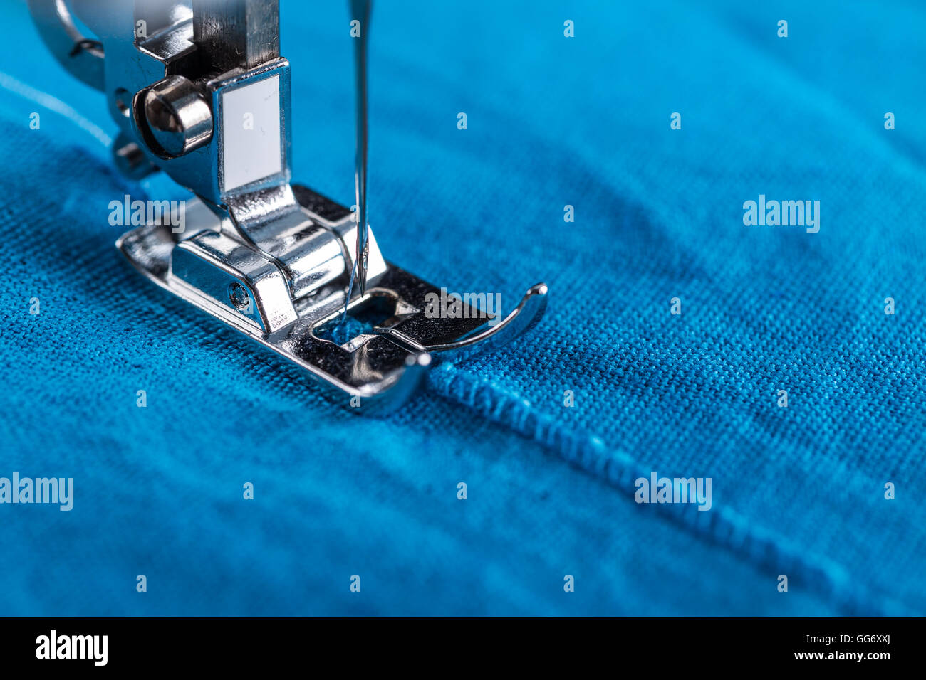 Background Of Close Up Sewing Machine Parts And Tools As Follows Needle,  Presser Foot, Threads, Bobbin, Replace Buttons On Jean Fabric. Stock Photo,  Picture and Royalty Free Image. Image 83813242.