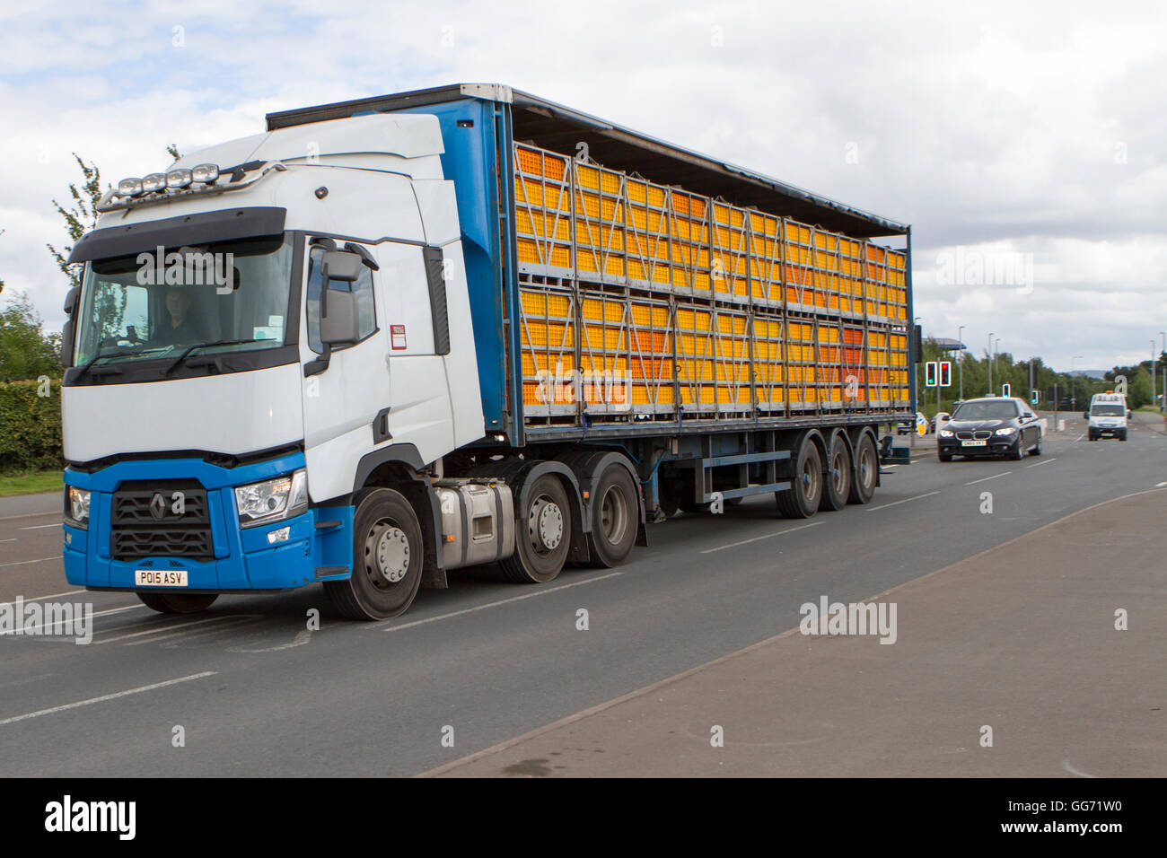 Unmarked lorry transporting caged live chickens, cages and birds. Livestock haulage in Preston, Lancashire, UK Stock Photo