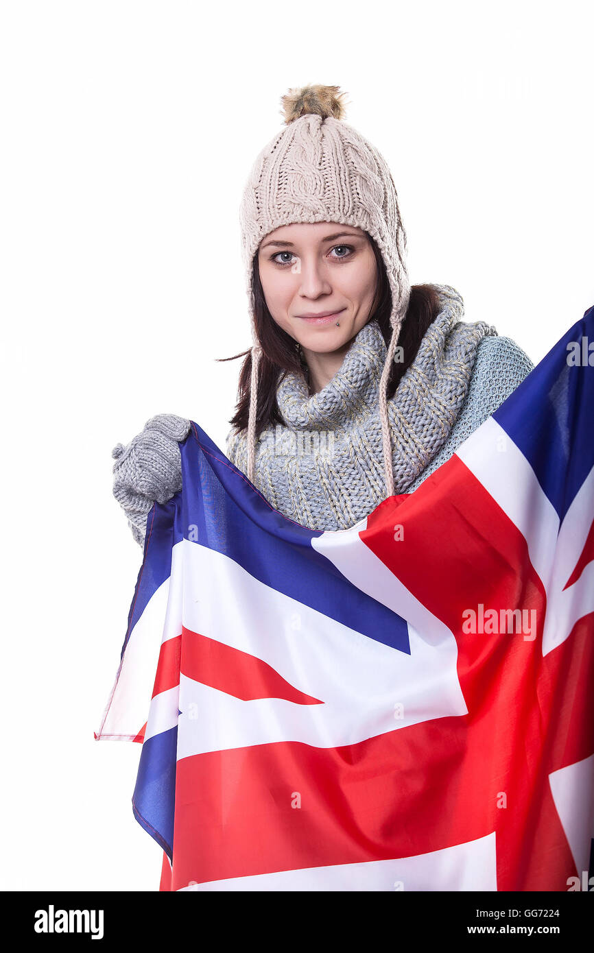 Portrait of a beautiful British girl smiling holding up the UK flag