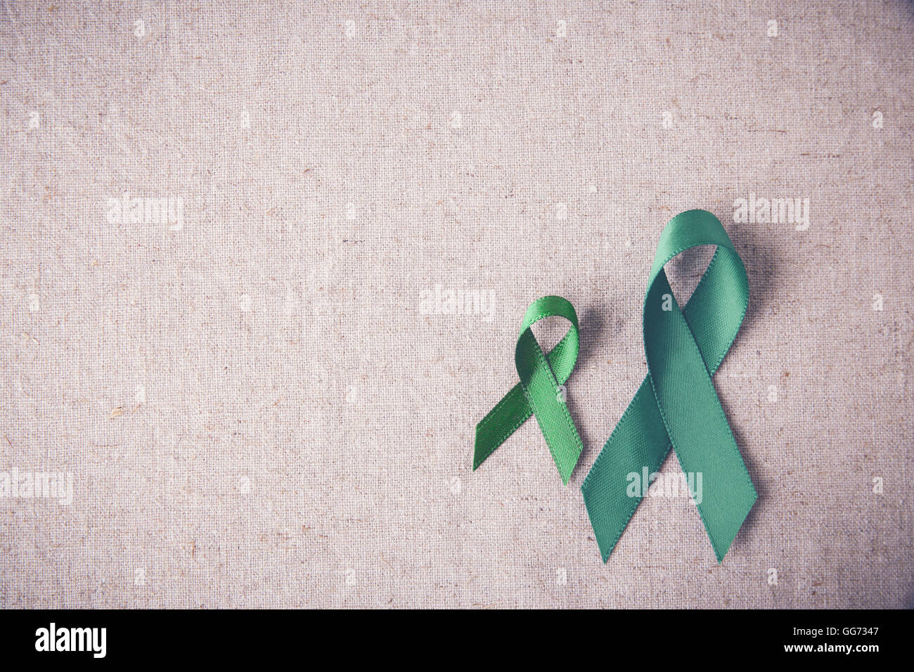 Green Ribbons copy space toning background, cancer awareness, Liver, kidney cancer awareness Stock Photo