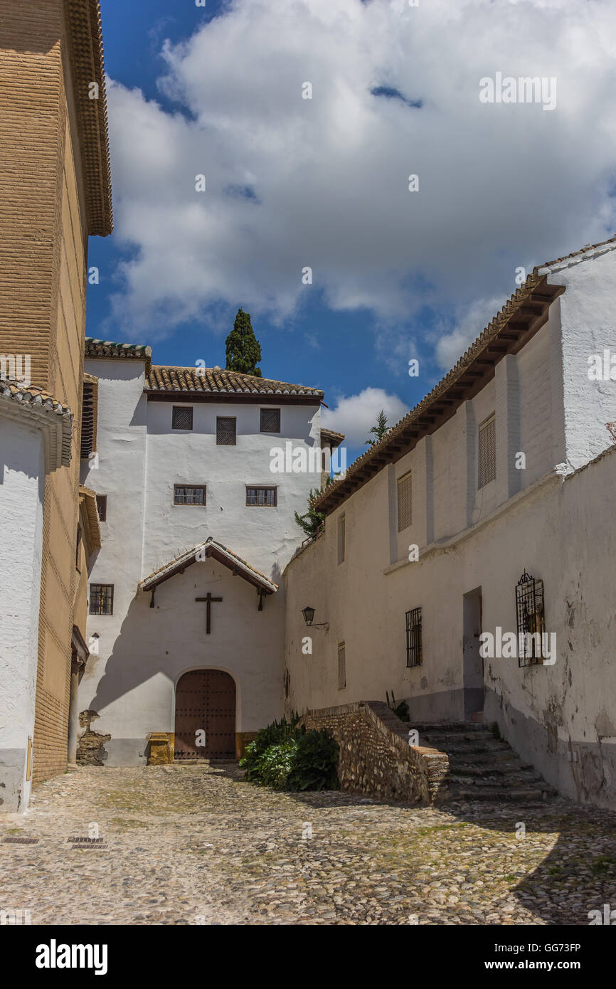 Courtyard and church in moorish Granada quarter Albaicin Stock Photo