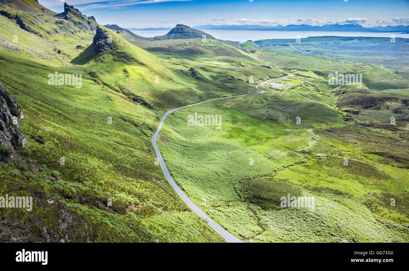 Empty Asphalt Road Across Green Slopes of Scottish Highlands Stock Photo