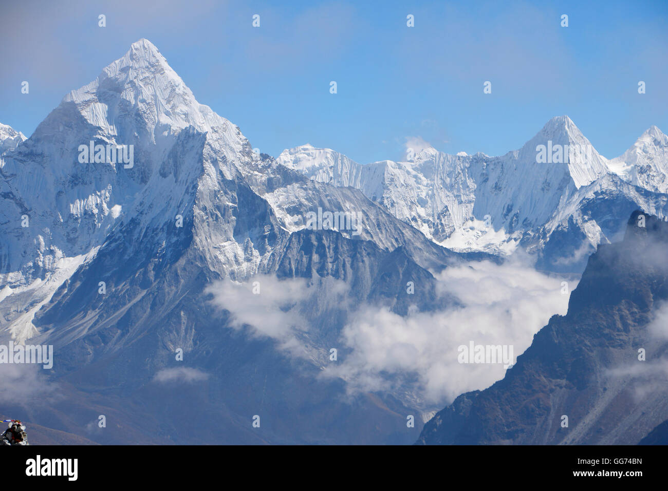 View looking down towards Ama Dablam Peak backdrop from Cho La Pass Stock Photo
