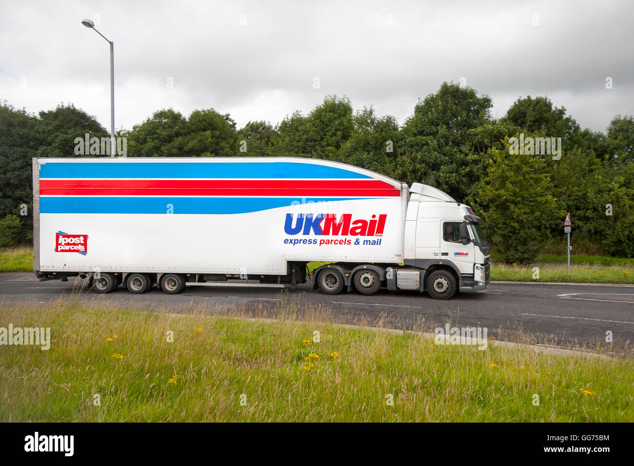 UK Mail, IPost Express parcels & Mail, UK Mail, a trading name of DHL Parcel UK Limited. A postal service company operating in the United Kingdom, which has competed with Royal Mail in the collection and distribution of mail, since the deregulation of the postal service in January 2006. HGV delivering in Preston, Lancashire, UK Stock Photo