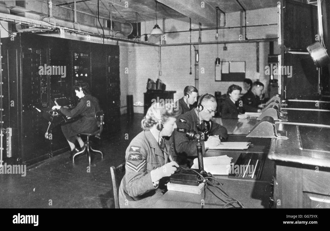 A British "Chain Home" radar receiver room during World War II with console visible at right and receiver at left. Stock Photo