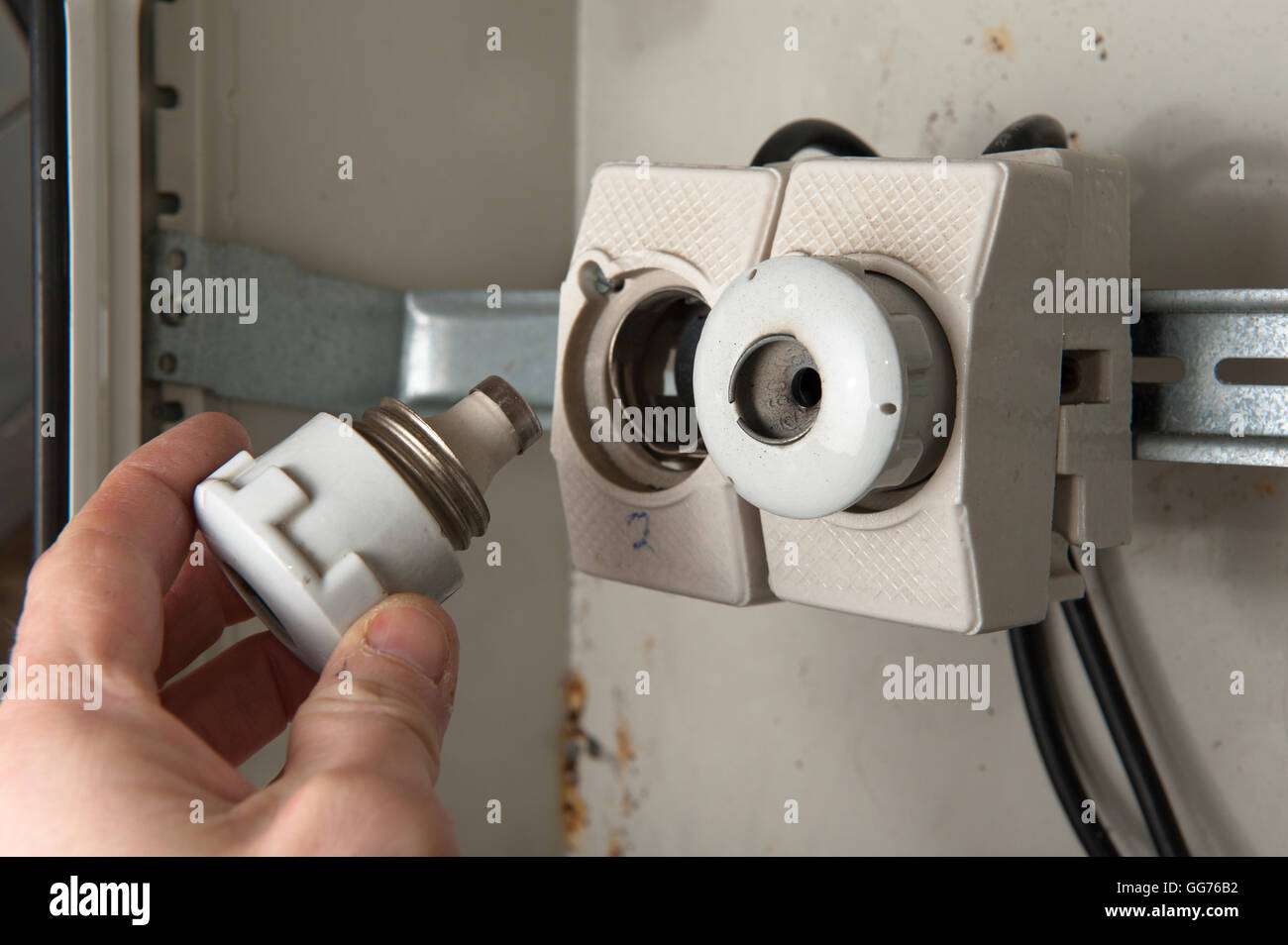 Person changing a broken fuse Stock Photo Alamy