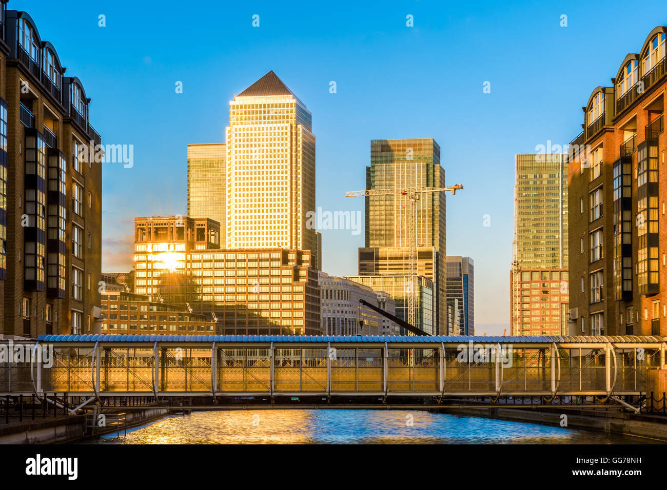 Canary Wharf, financial hub in London at sunset seen from Nelson Dock Pier Stock Photo