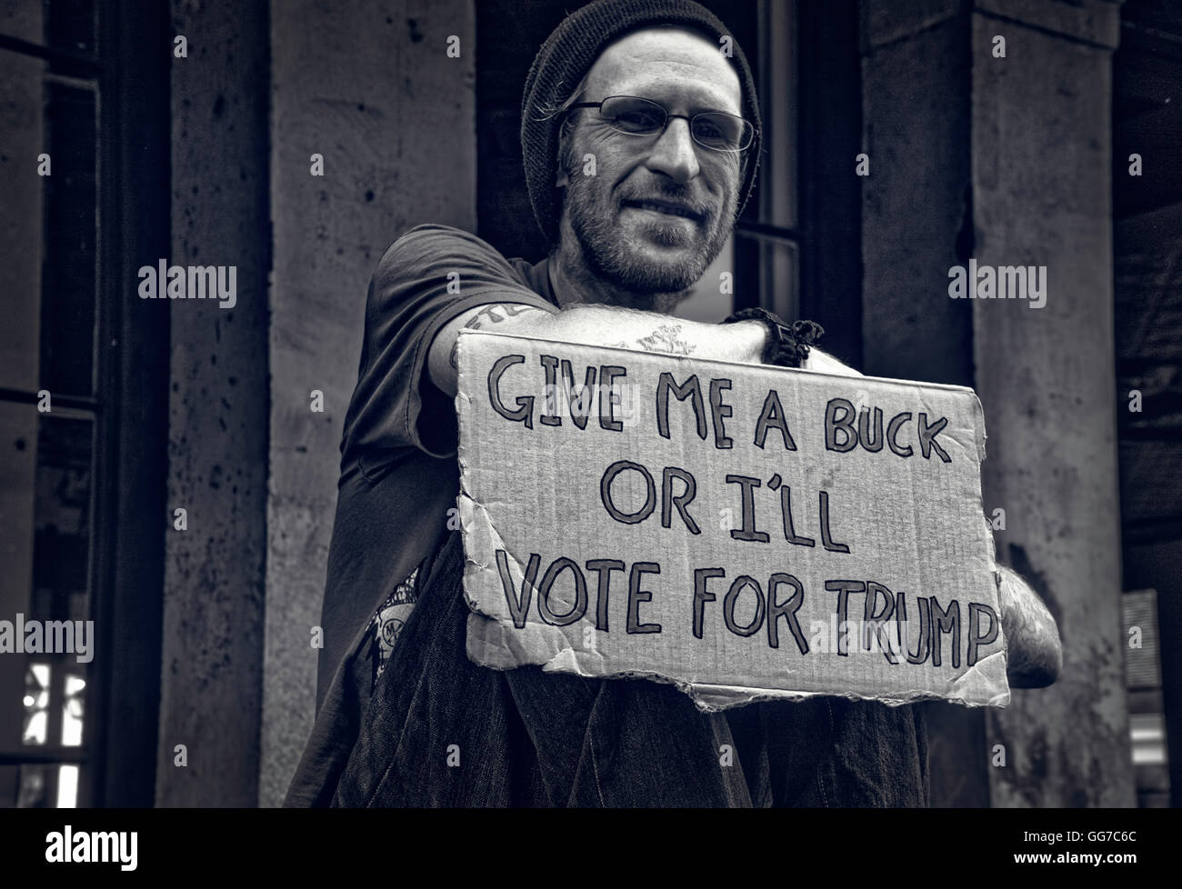 Young man asking for spare change in New Orleans Stock Photo - Alamy