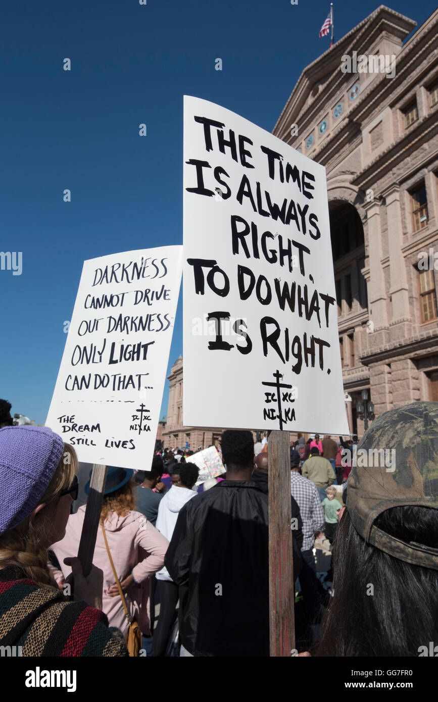 Marcher holds placard with Martin Luther King quote during MLK Day rally at the state Capitol building in Austin. Stock Photo