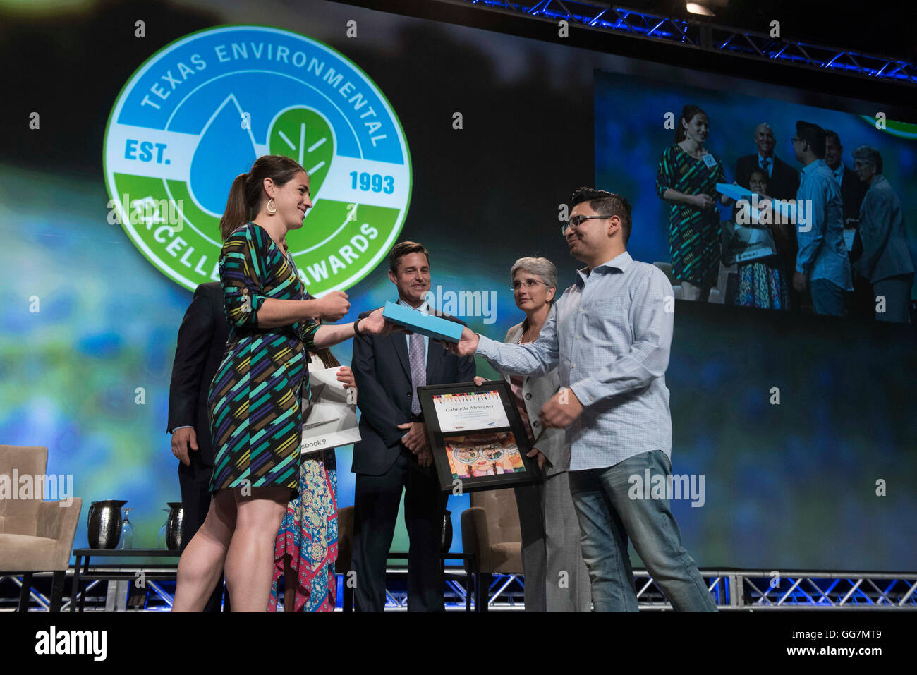 Texas Environmental Excellence Award winners pose on stage with members of the Texas Commission on Environmental Quality Stock Photo