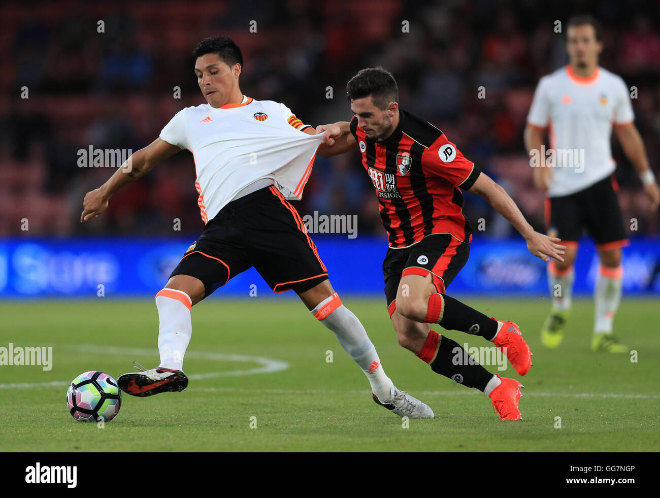 Bournemouth's Lewis Cook and Valencia's Enzo Perez battle for the ball during the pre-season match at the Vitality Stadium, Bournemouth. Stock Photo