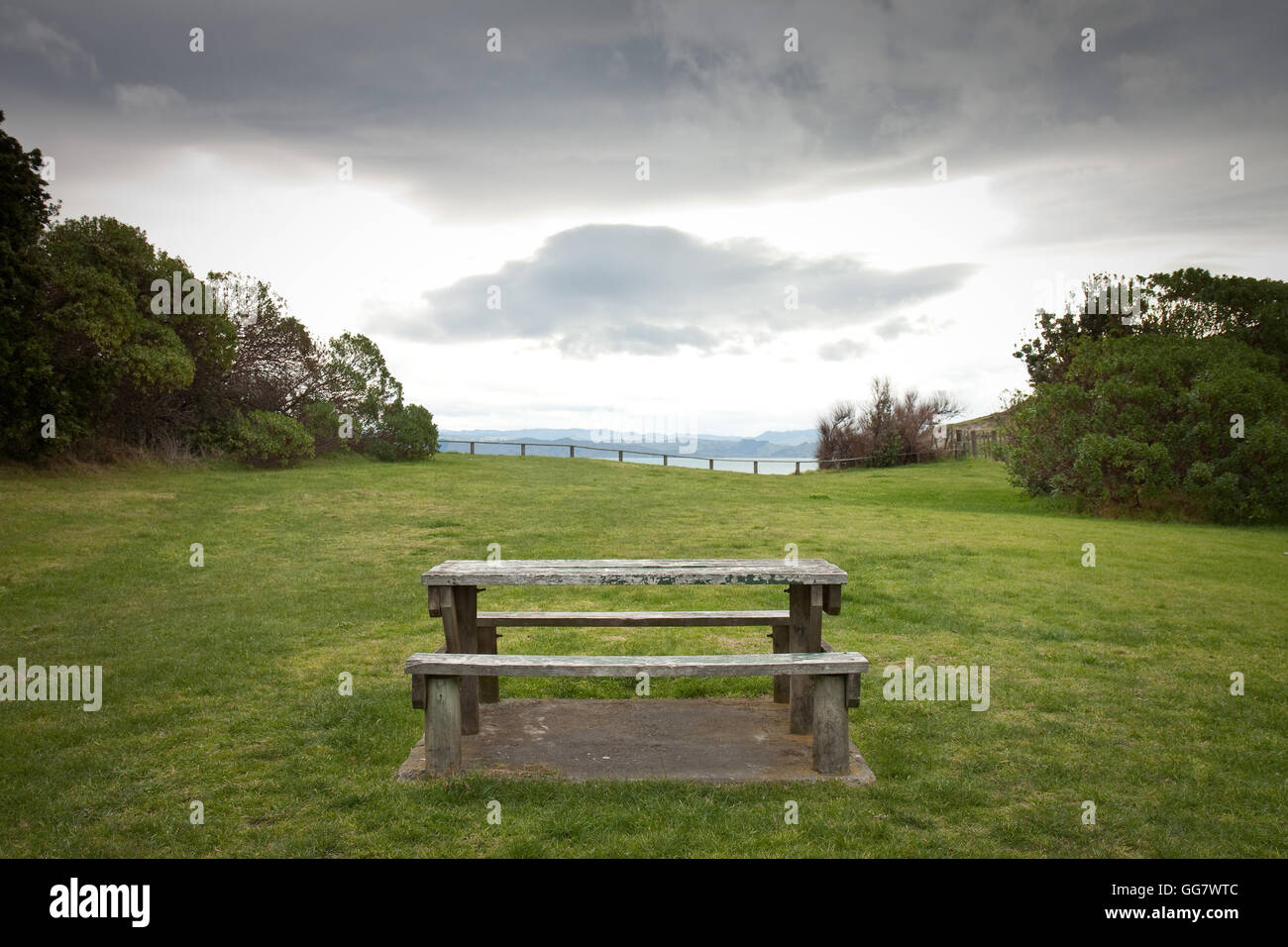 abandoned picnic bench at a New Zealand beach in winter Stock Photo