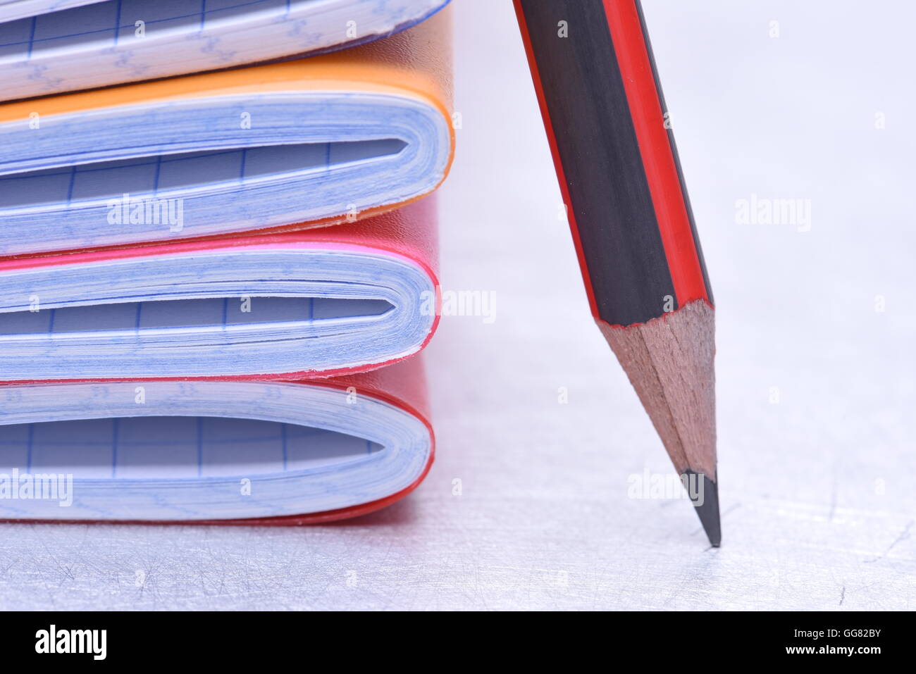 Exercise books and pencil Stock Photo - Alamy