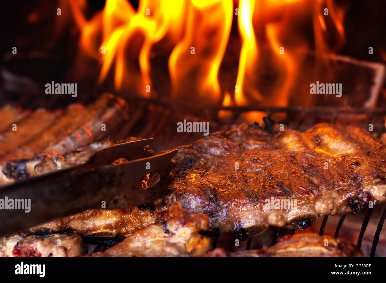 Grilled ribs on barbecue. Family party. Stock Photo