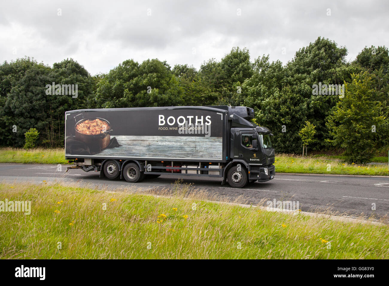 Booths supermarket Delivery. food truck van approaching depot in ...