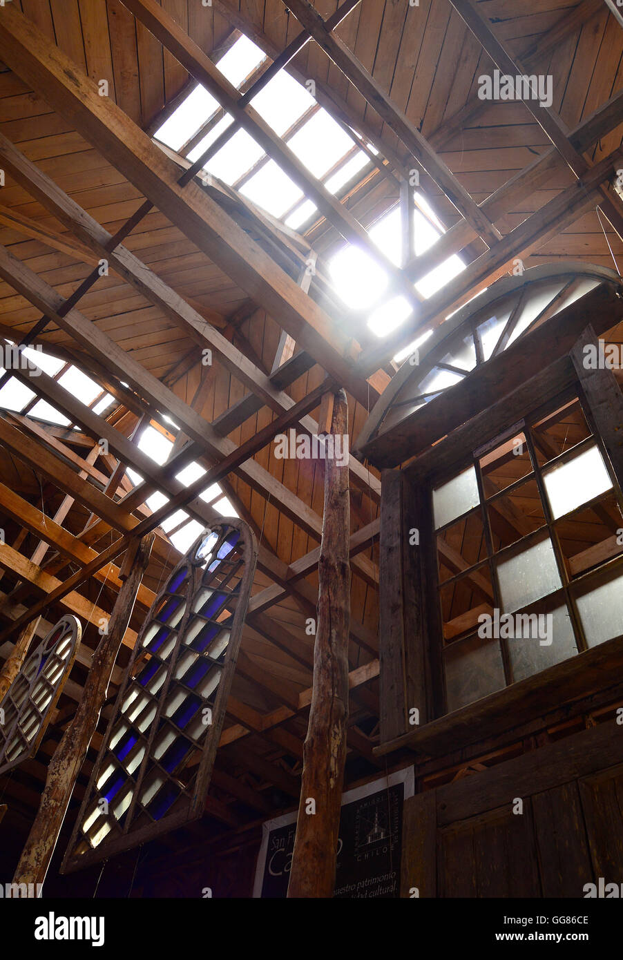 Stained glass windows and high wooden beams in an exhibit at the Museo de las Iglesias de Chiloe, Ancud, Chile. Stock Photo